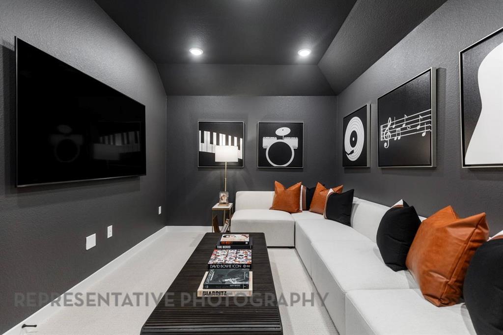 2132 Nerello Way Rockwall, TX 75032 - Photo 36 of 40 a living room with furniture and a flat screen tv