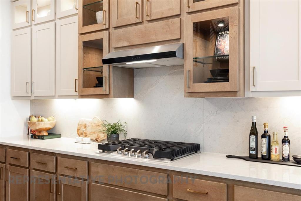 2132 Nerello Way Rockwall, TX 75032 - Photo 4 of 40 a kitchen with stainless steel appliances granite countertop a sink and cabinets