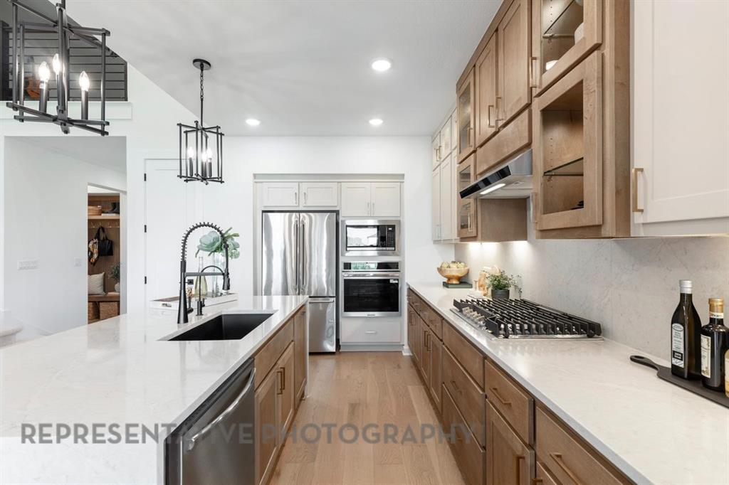 2132 Nerello Way Rockwall, TX 75032 - Photo 6 of 40 a kitchen that has a lot of cabinets in it