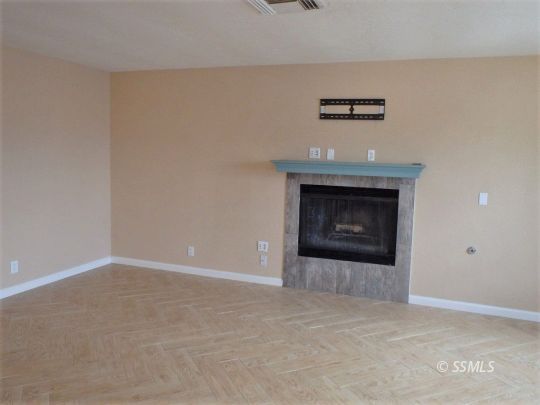 412 North Mono Street Ridgecrest, CA 93555 - Photo 12 of 50 a view of an empty room with a fireplace