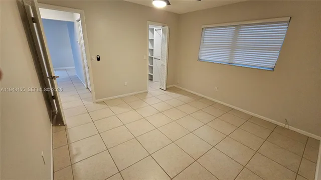 a view of an empty room and window