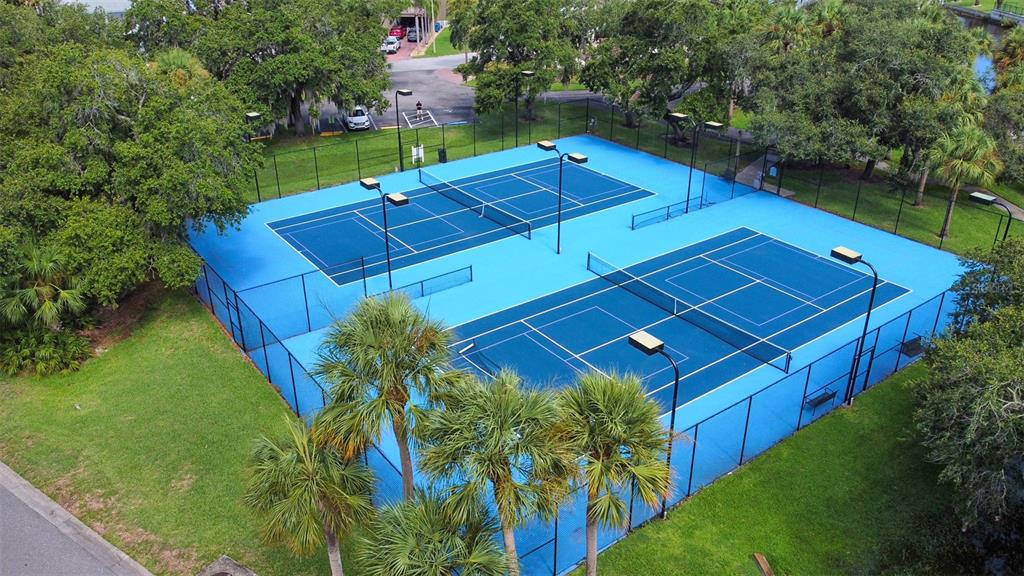 6517 Channelside Drive New Port Richey, FL 34652 - Photo 24 of 31 a view of a tennis ground with a small pool