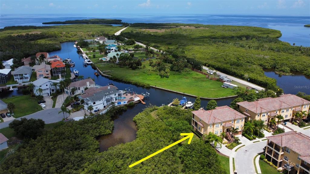 6517 Channelside Drive New Port Richey, FL 34652 - Photo 25 of 31 an aerial view of residential houses with outdoor space and river