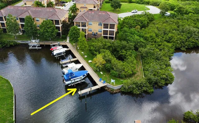 an aerial view of a house with pool garden