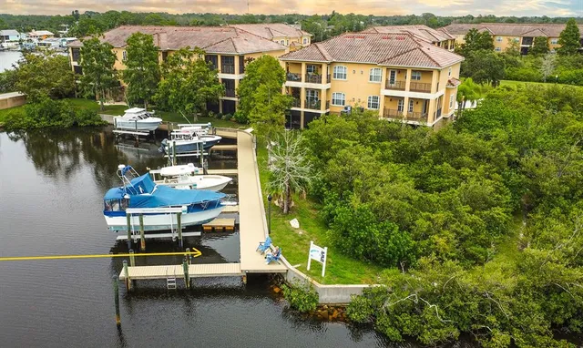 an aerial view of a house with a yard table and chairs