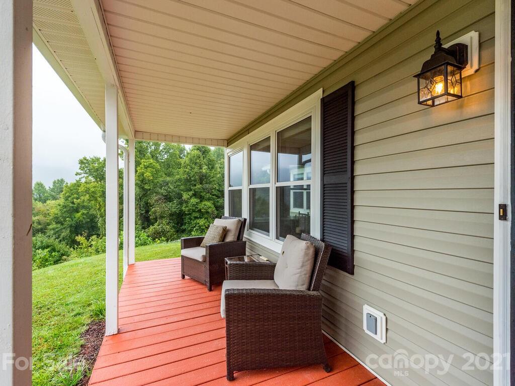 595 Hunters Ridge Road, Unit 20 Canton, NC 28716 - Photo 2 of 47 a outdoor living space with patio furniture and garden