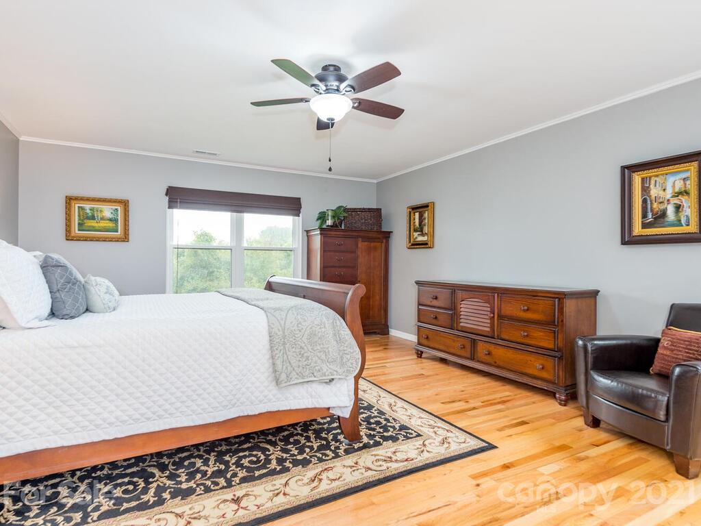 595 Hunters Ridge Road, Unit 20 Canton, NC 28716 - Photo 14 of 47 a bedroom with a bed and dresser