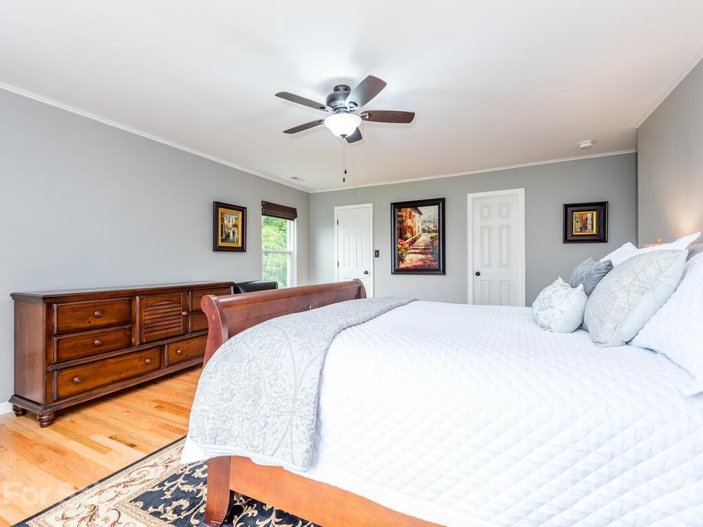 595 Hunters Ridge Road, Unit 20 Canton, NC 28716 - Photo 16 of 47 a bedroom with a bed and a dresser