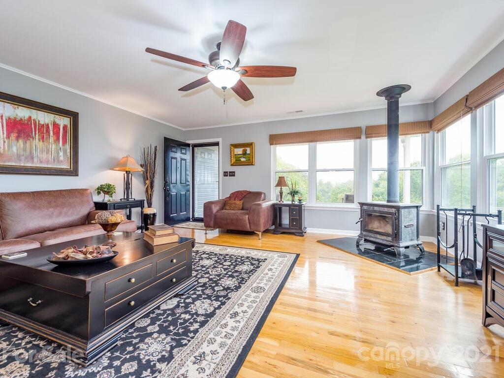 595 Hunters Ridge Road, Unit 20 Canton, NC 28716 - Photo 3 of 47 a living room with furniture and a floor to ceiling window