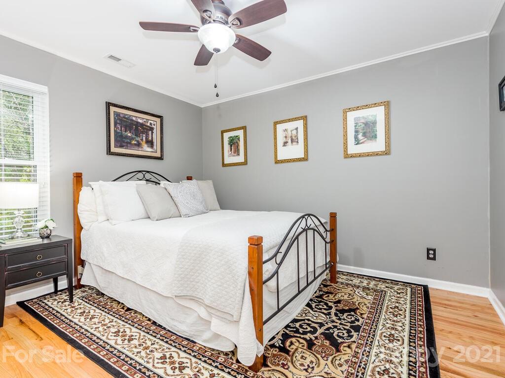 595 Hunters Ridge Road, Unit 20 Canton, NC 28716 - Photo 23 of 47 a bedroom with a bed and a window