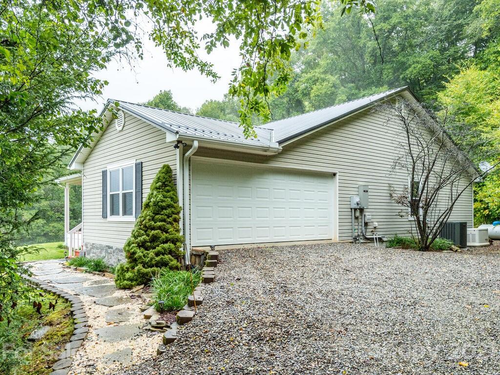595 Hunters Ridge Road, Unit 20 Canton, NC 28716 - Photo 36 of 47 a house that has a tree in front of it