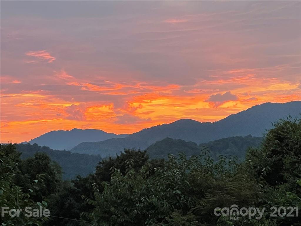 595 Hunters Ridge Road, Unit 20 Canton, NC 28716 - Photo 45 of 47 a view of a lake and mountains