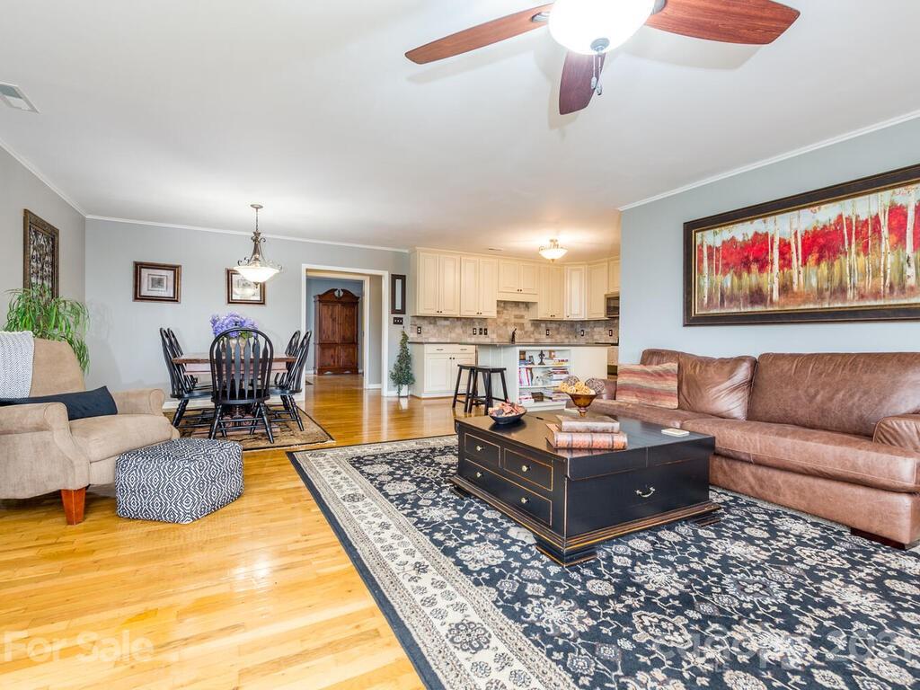 595 Hunters Ridge Road, Unit 20 Canton, NC 28716 - Photo 7 of 47 a living room with furniture and a rug