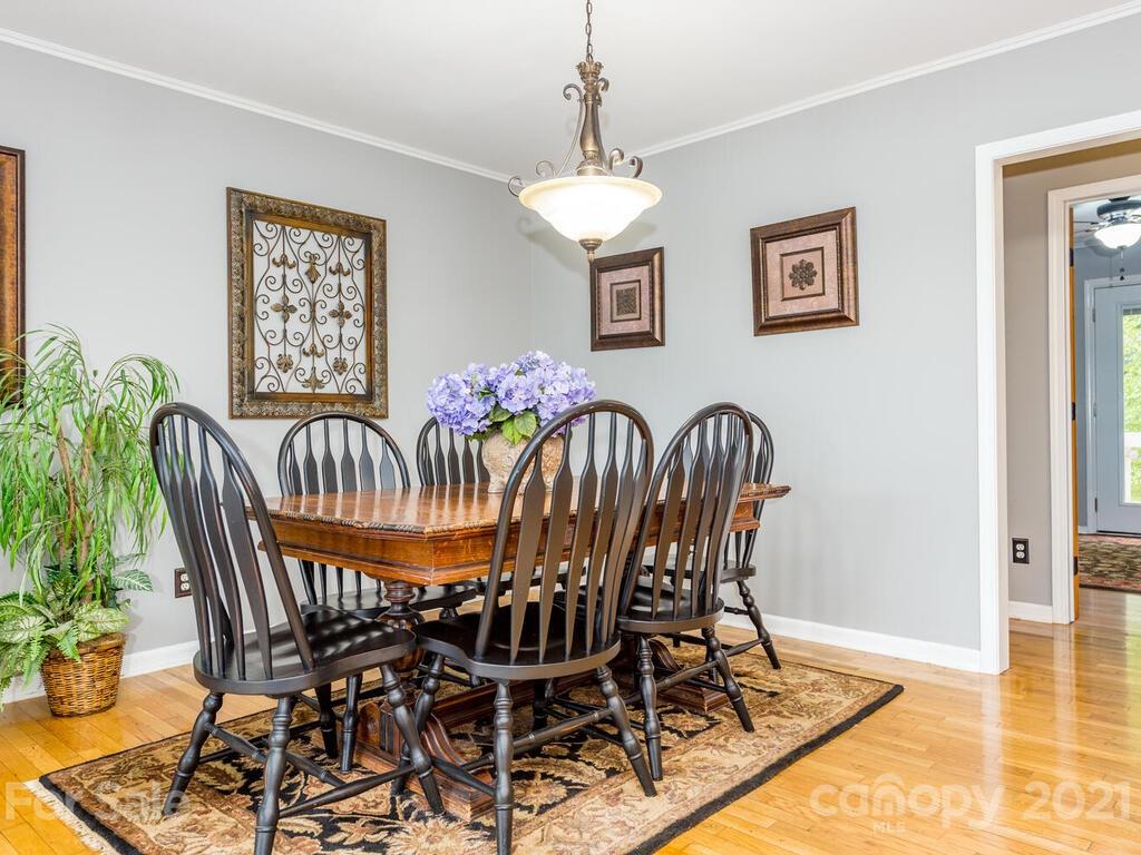 595 Hunters Ridge Road, Unit 20 Canton, NC 28716 - Photo 8 of 47 a view of a dining room with furniture and wooden floor