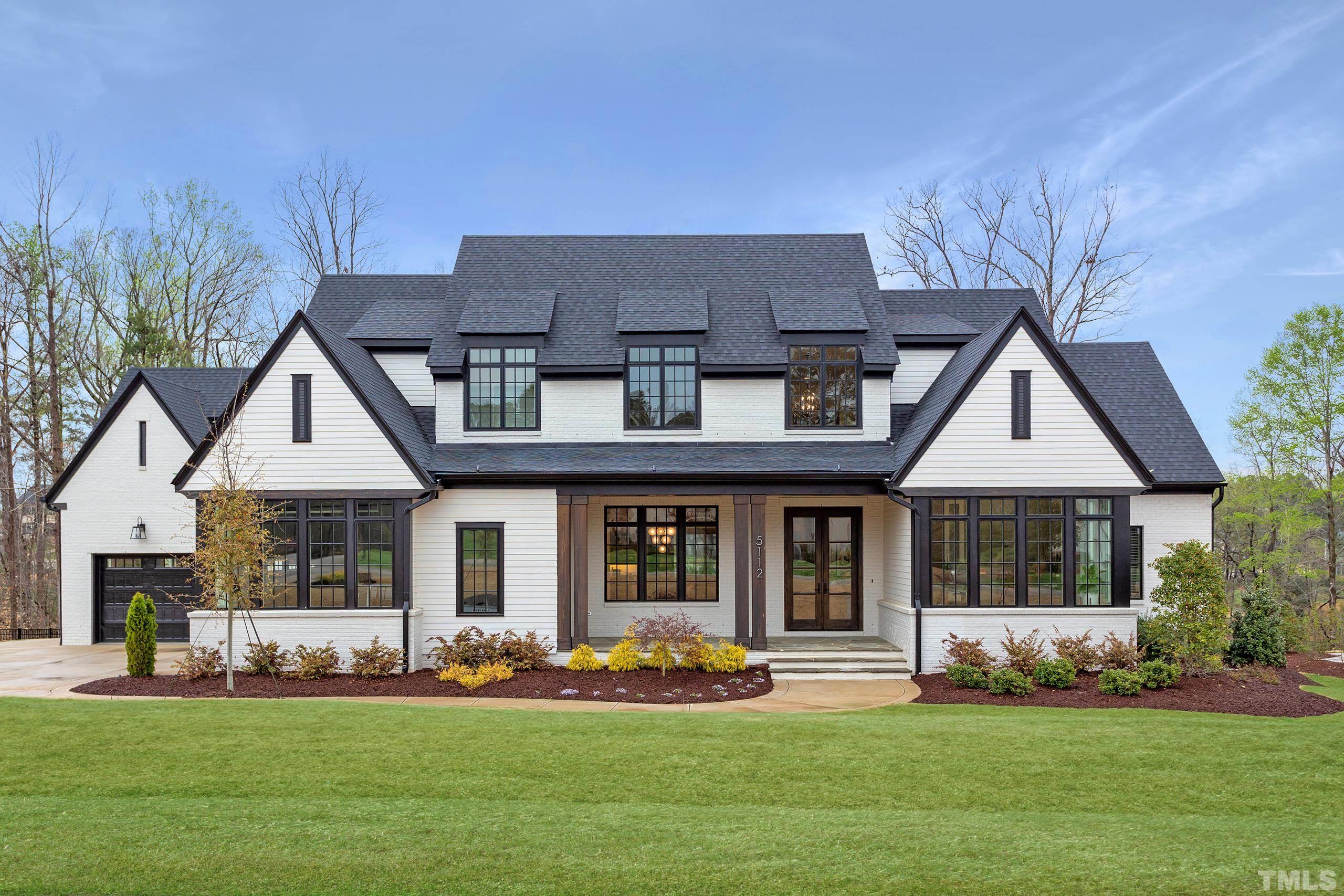 5112 Winding View Lane Raleigh, NC 27615 - Photo 1 of 71 a front view of a house with a garden and plants