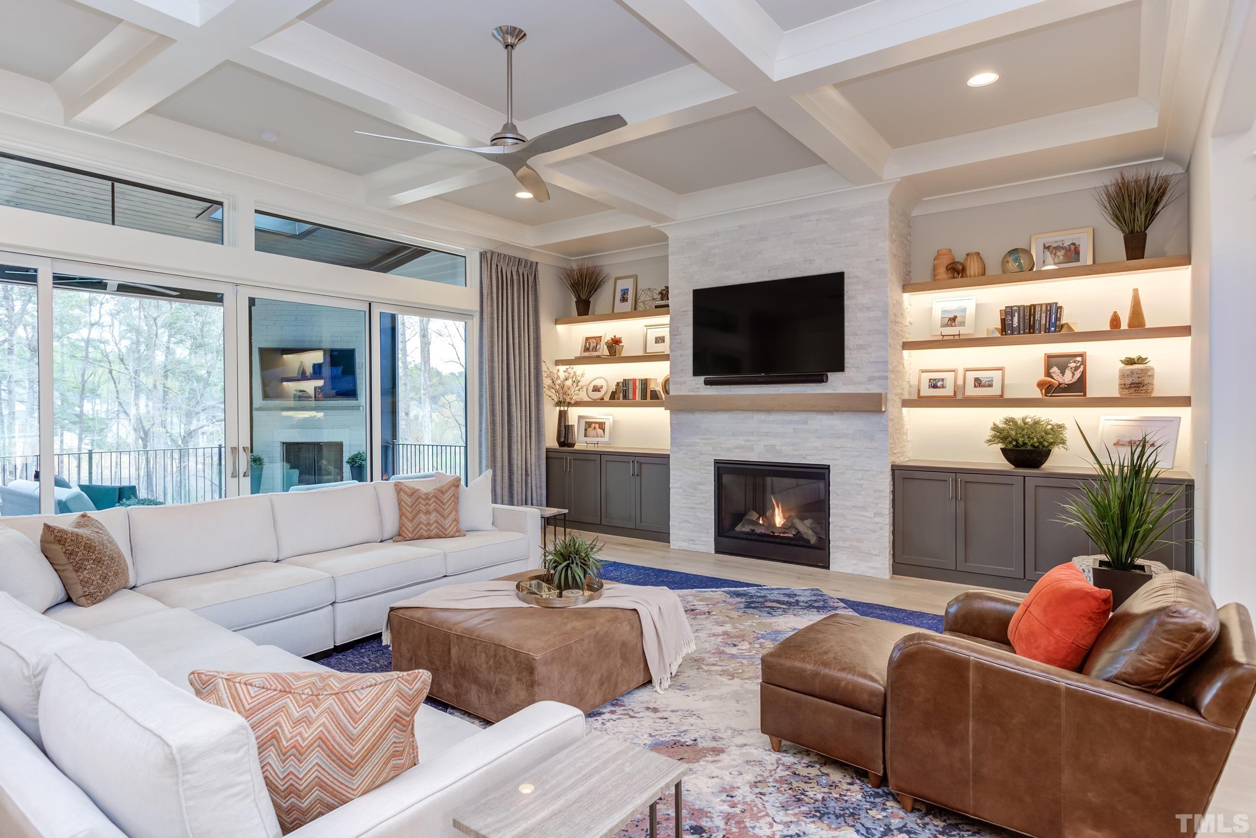 5112 Winding View Lane Raleigh, NC 27615 - Photo 16 of 71 a living room with furniture a fireplace and a flat screen tv