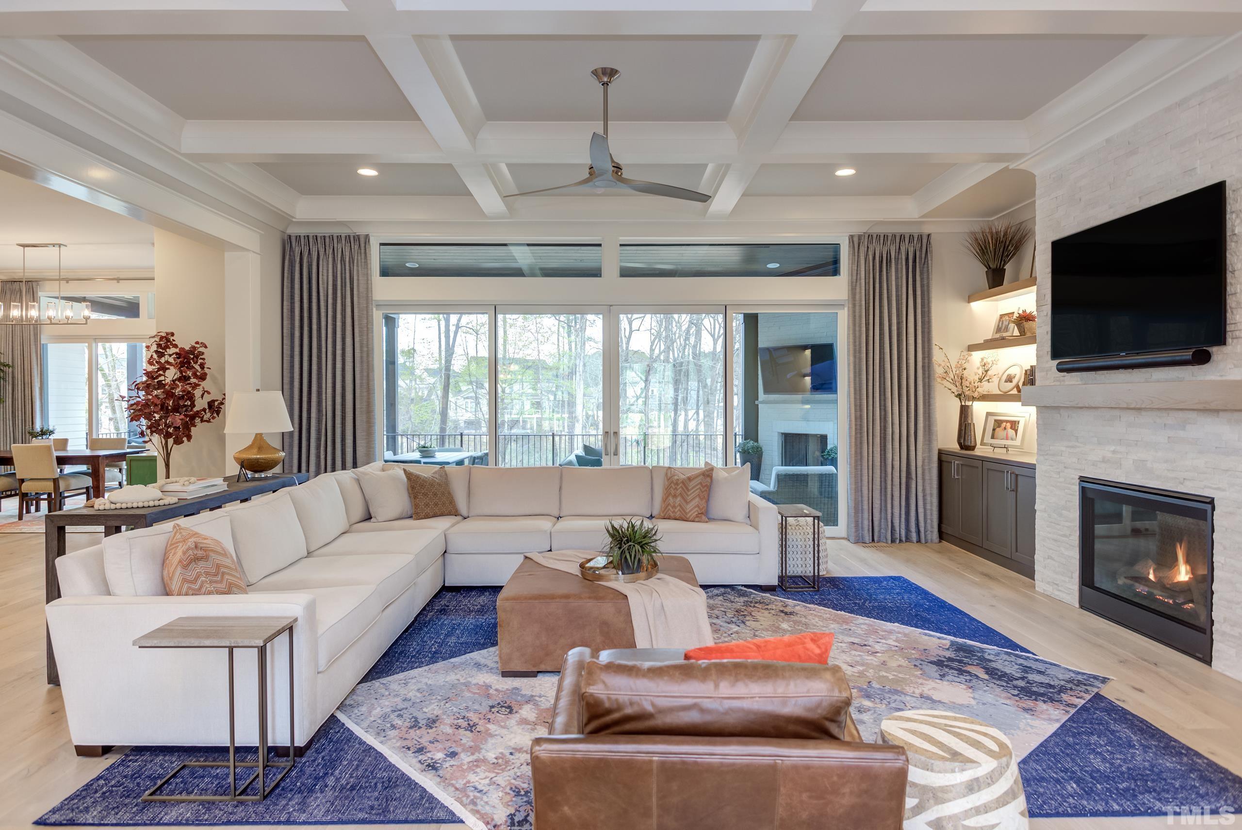 5112 Winding View Lane Raleigh, NC 27615 - Photo 18 of 71 a living room with furniture a fireplace and a flat screen tv