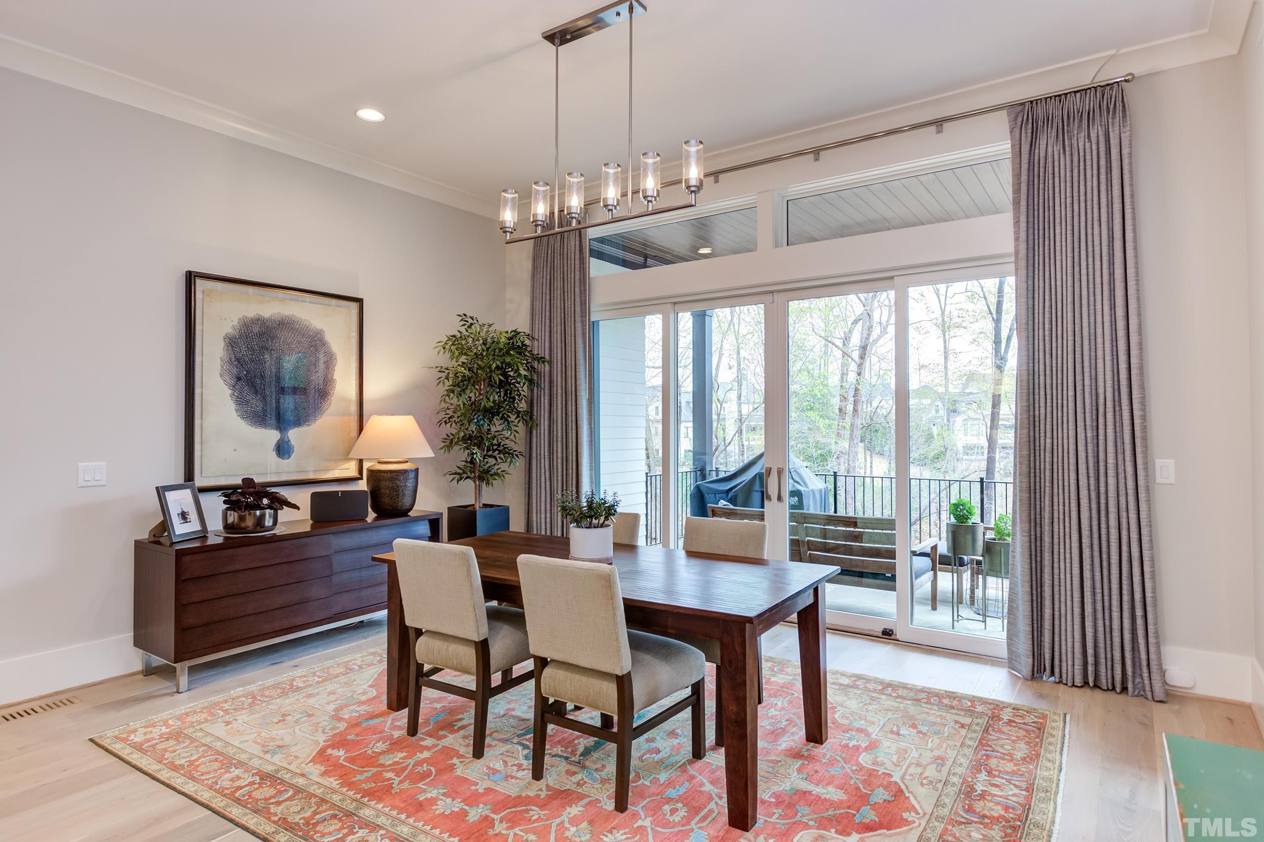 5112 Winding View Lane Raleigh, NC 27615 - Photo 26 of 71 a view of a dining room with furniture window and wooden floor