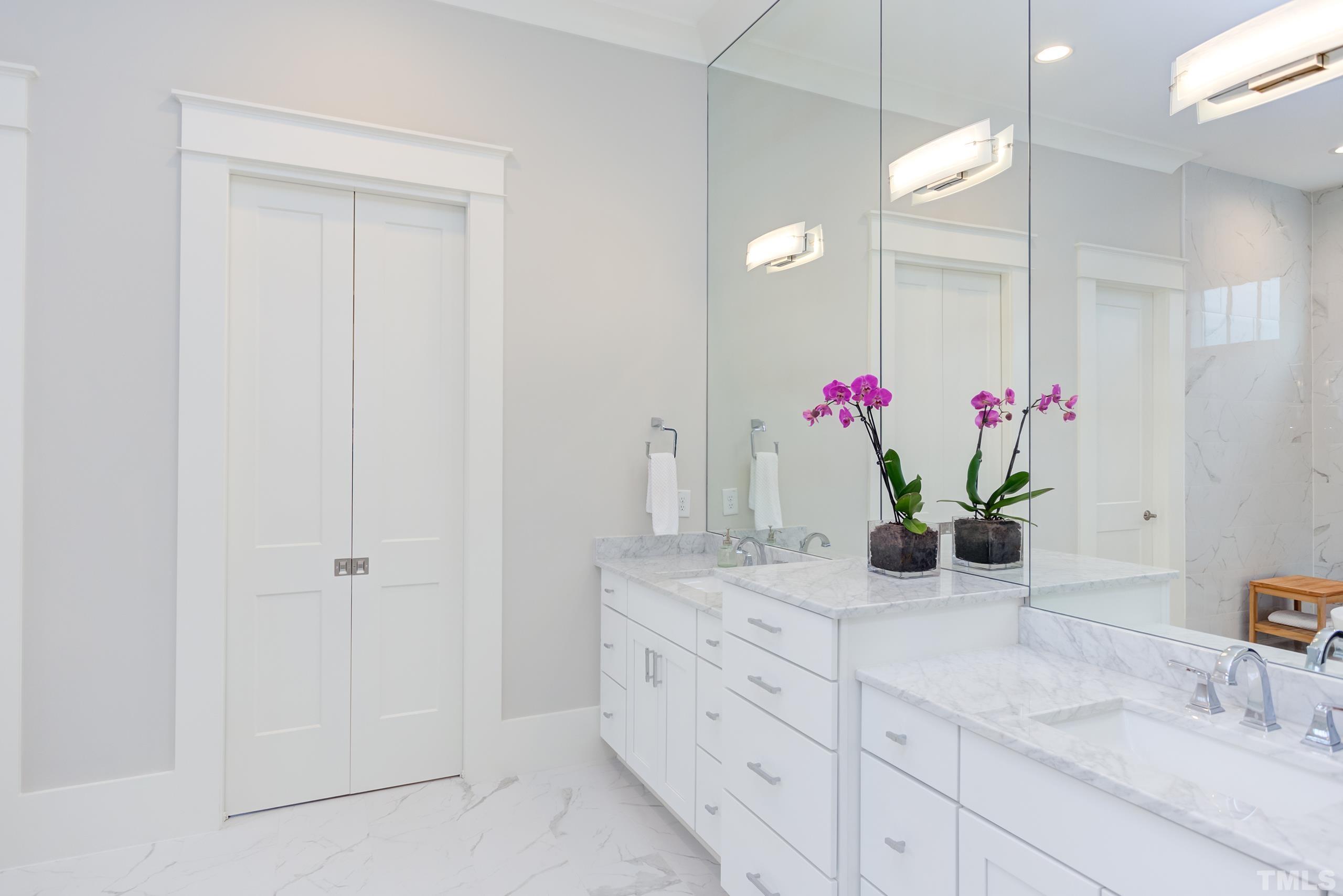 5112 Winding View Lane Raleigh, NC 27615 - Photo 33 of 71 a bathroom with a granite countertop sink a potted plant and a mirror