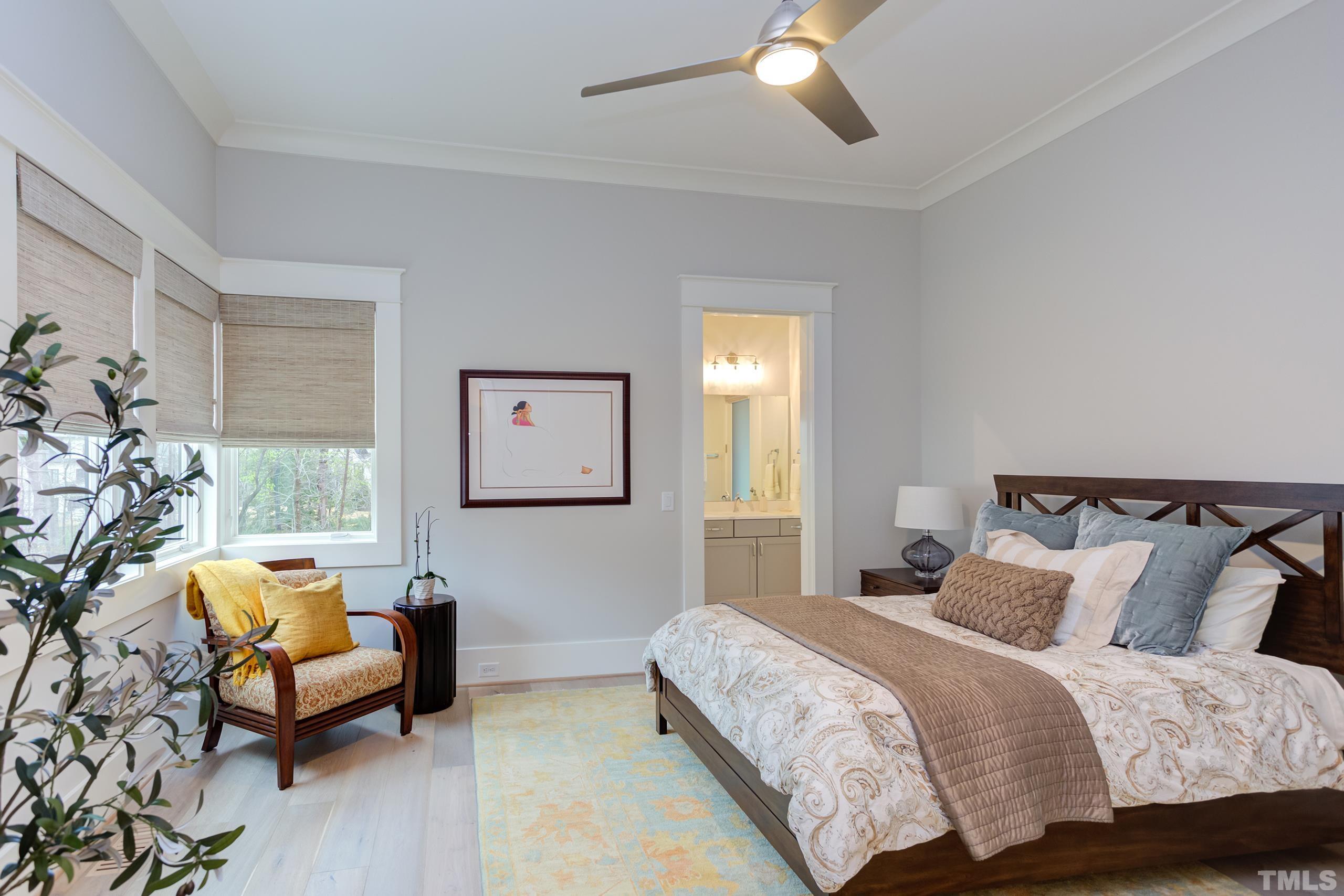 5112 Winding View Lane Raleigh, NC 27615 - Photo 39 of 71 a bedroom with a bed and a couch