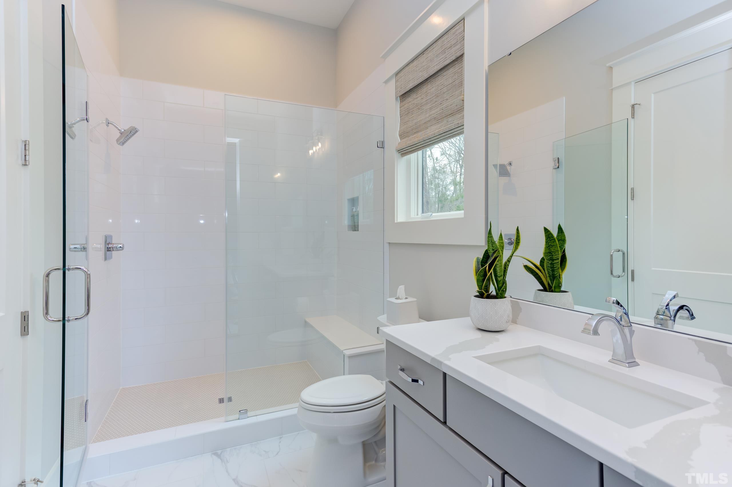 5112 Winding View Lane Raleigh, NC 27615 - Photo 40 of 71 a bathroom with a sink toilet and shower