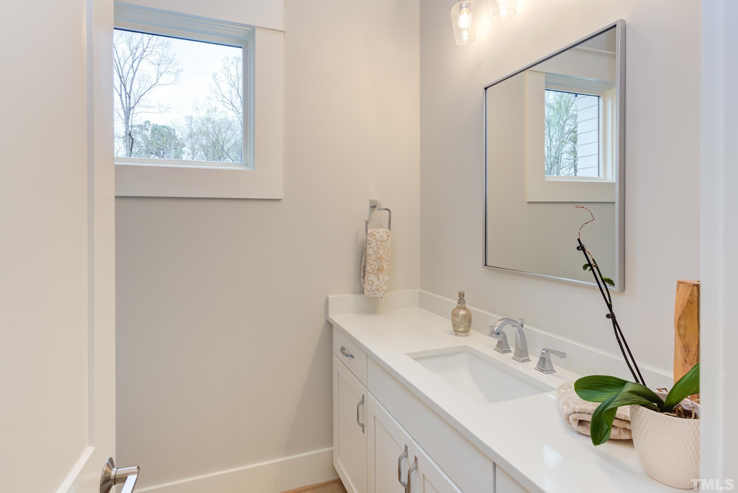5112 Winding View Lane Raleigh, NC 27615 - Photo 47 of 71 a bathroom with a sink and a window