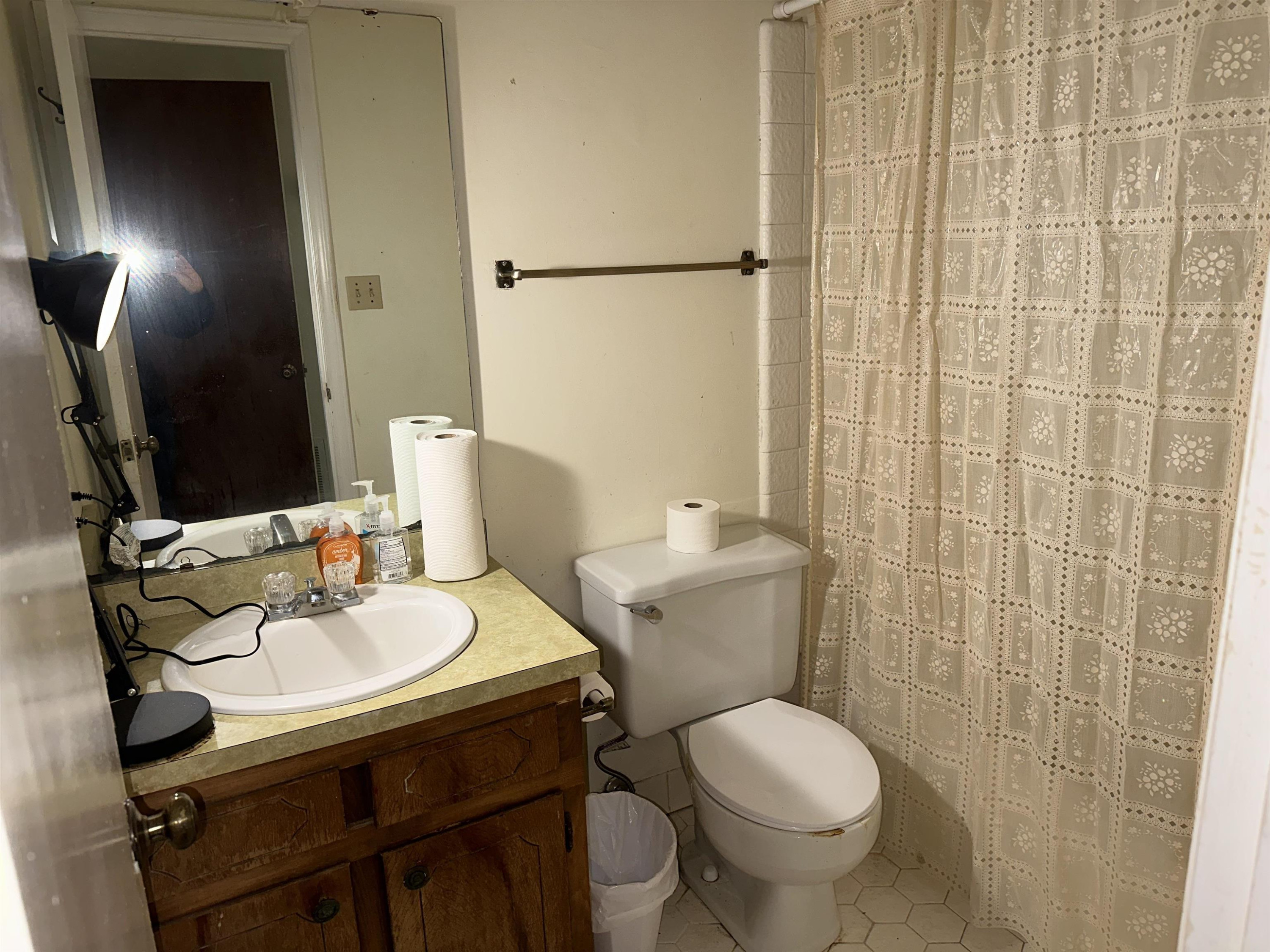 6000 Neuse Street Raleigh, NC 27610 - Photo 12 of 13 a bathroom with a sink toilet and shower