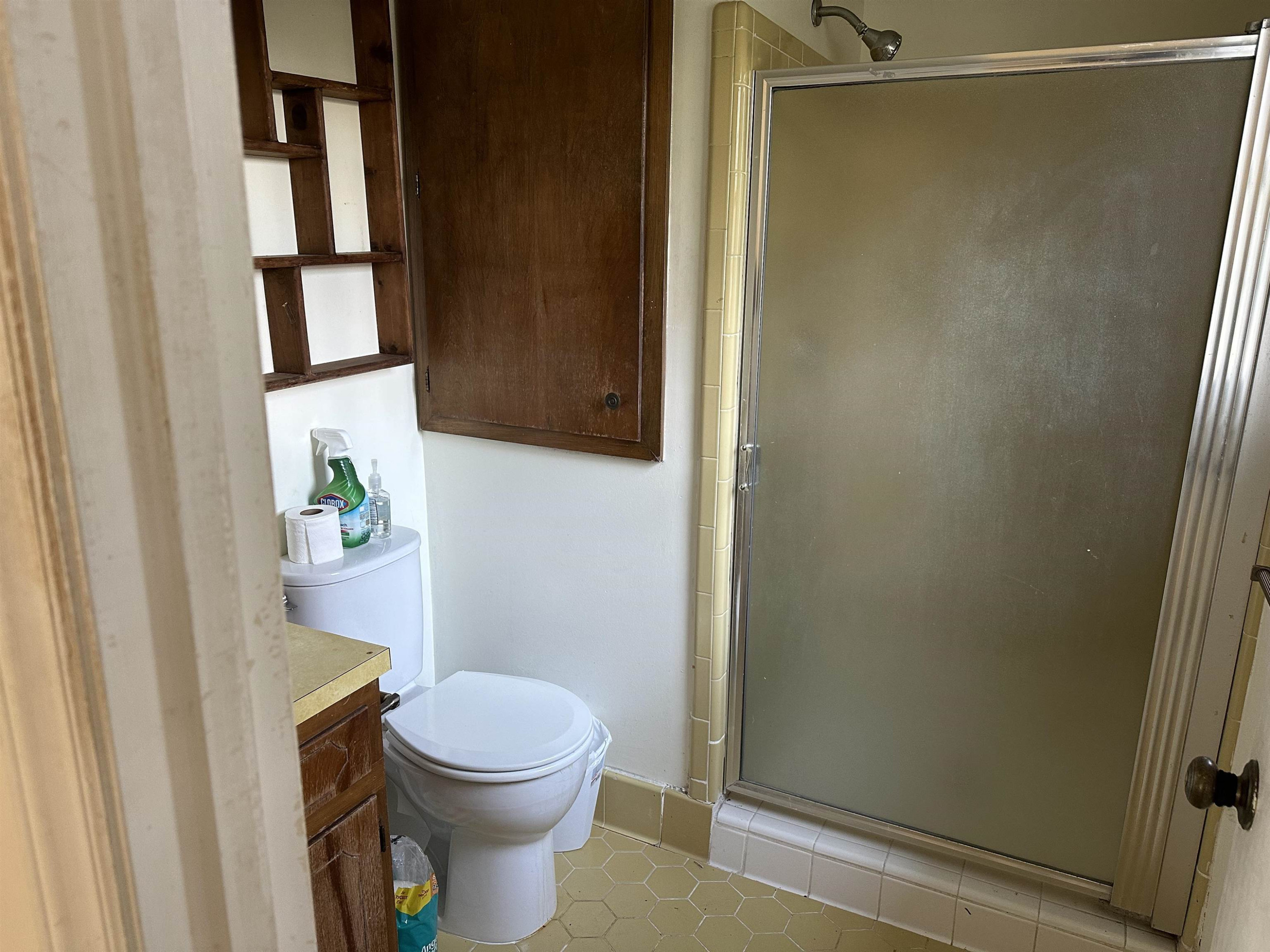 6000 Neuse Street Raleigh, NC 27610 - Photo 13 of 13 a white toilet sitting next to a shower