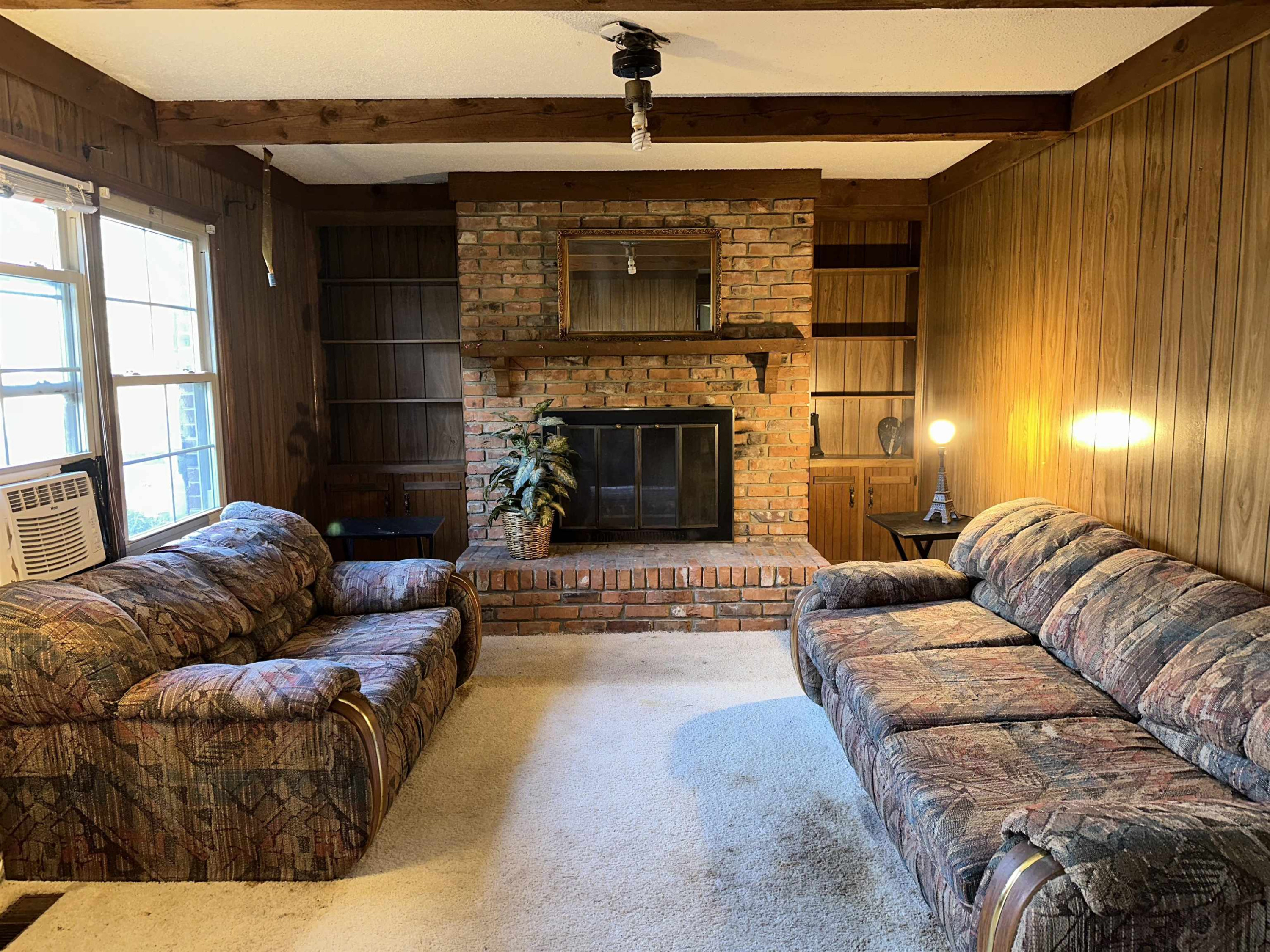 6000 Neuse Street Raleigh, NC 27610 - Photo 4 of 13 a living room with furniture and a fireplace