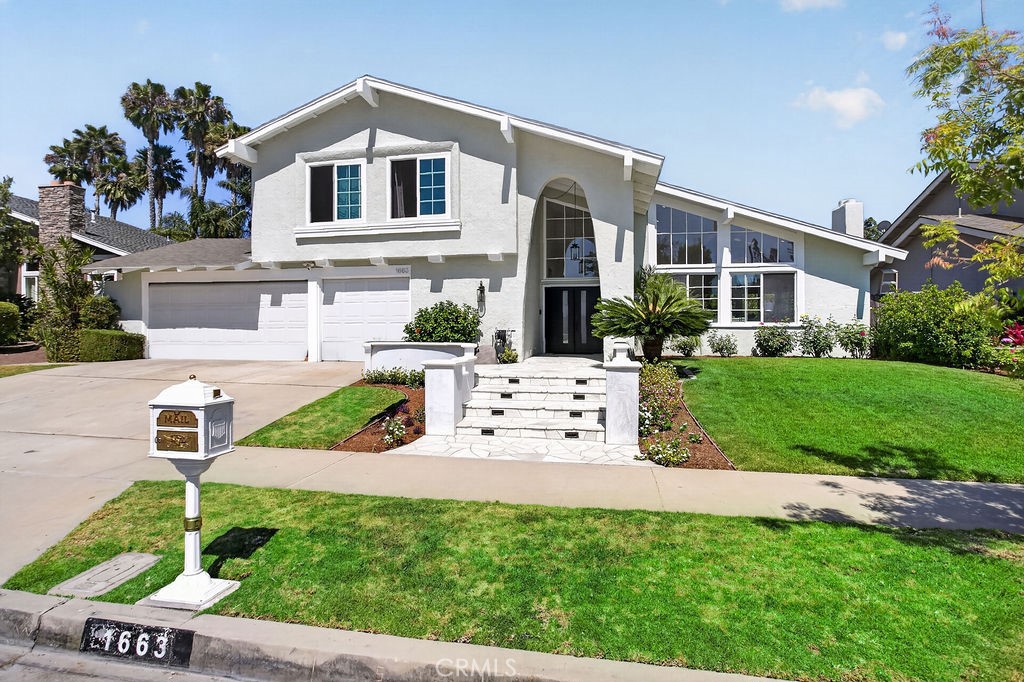 1663 North Yurok Street Orange, CA 92867 - Photo 2 of 31 a front view of a house with garden