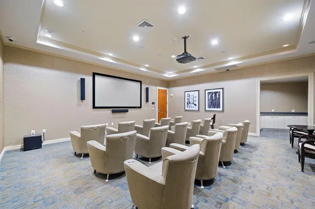 a living room with couches and a flat screen tv