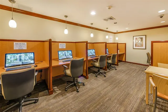 a view of a workspace with furniture and lounge chair