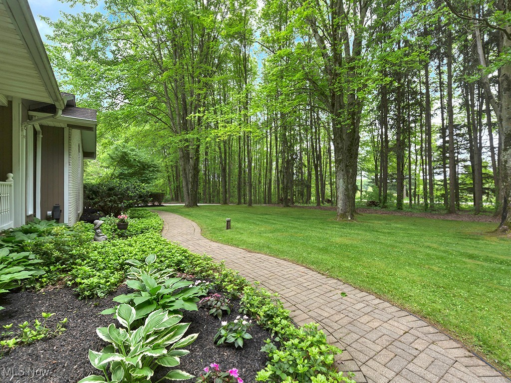 11050 Bell Road Newbury, OH 44065 - Photo 6 of 38 A view of the brick walk in the front yard as you approach the front porch and welcoming front door.