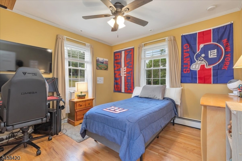 79 Main Street Califon, NJ 07830 - Photo 24 of 50 a bedroom with a bed and a dresser next to a window