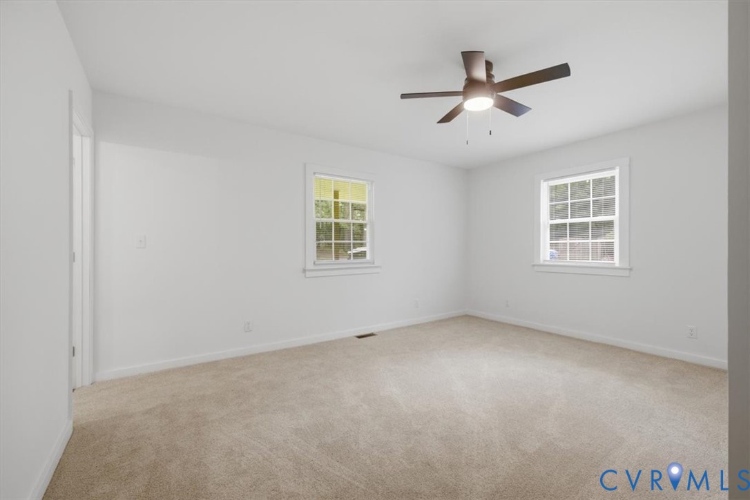 2338 George's Road Powhatan, VA 23139 - Photo 14 of 25 Neutral-toned carpet flooring, two windows with wh