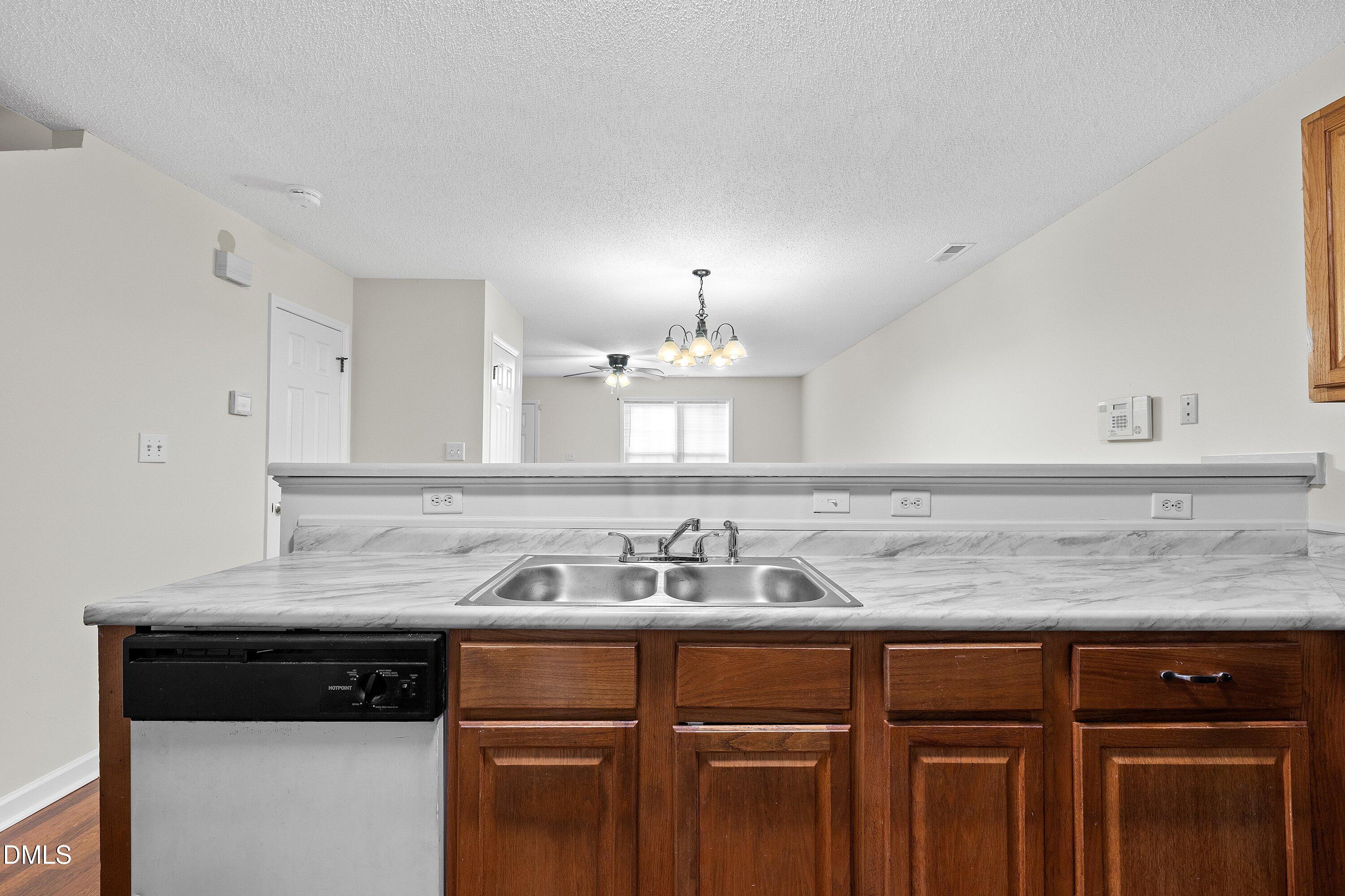 2241 Violet Bluff Court Raleigh, NC 27610 - Photo 12 of 28 a kitchen with a sink and cabinets