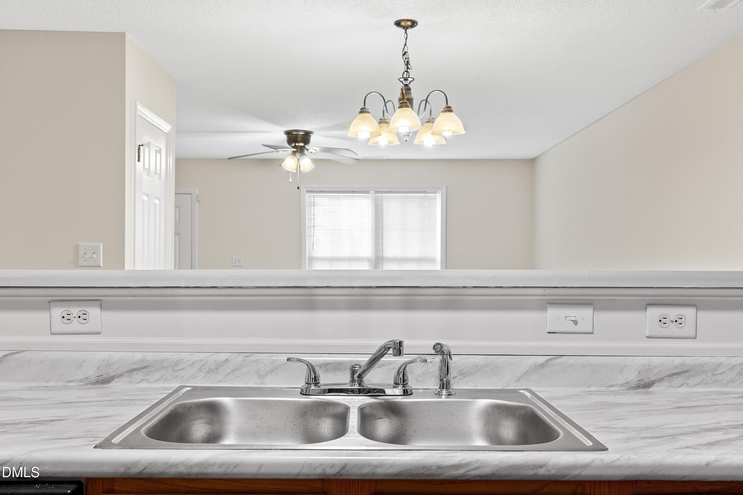 2241 Violet Bluff Court Raleigh, NC 27610 - Photo 13 of 28 a close view of sink and tap