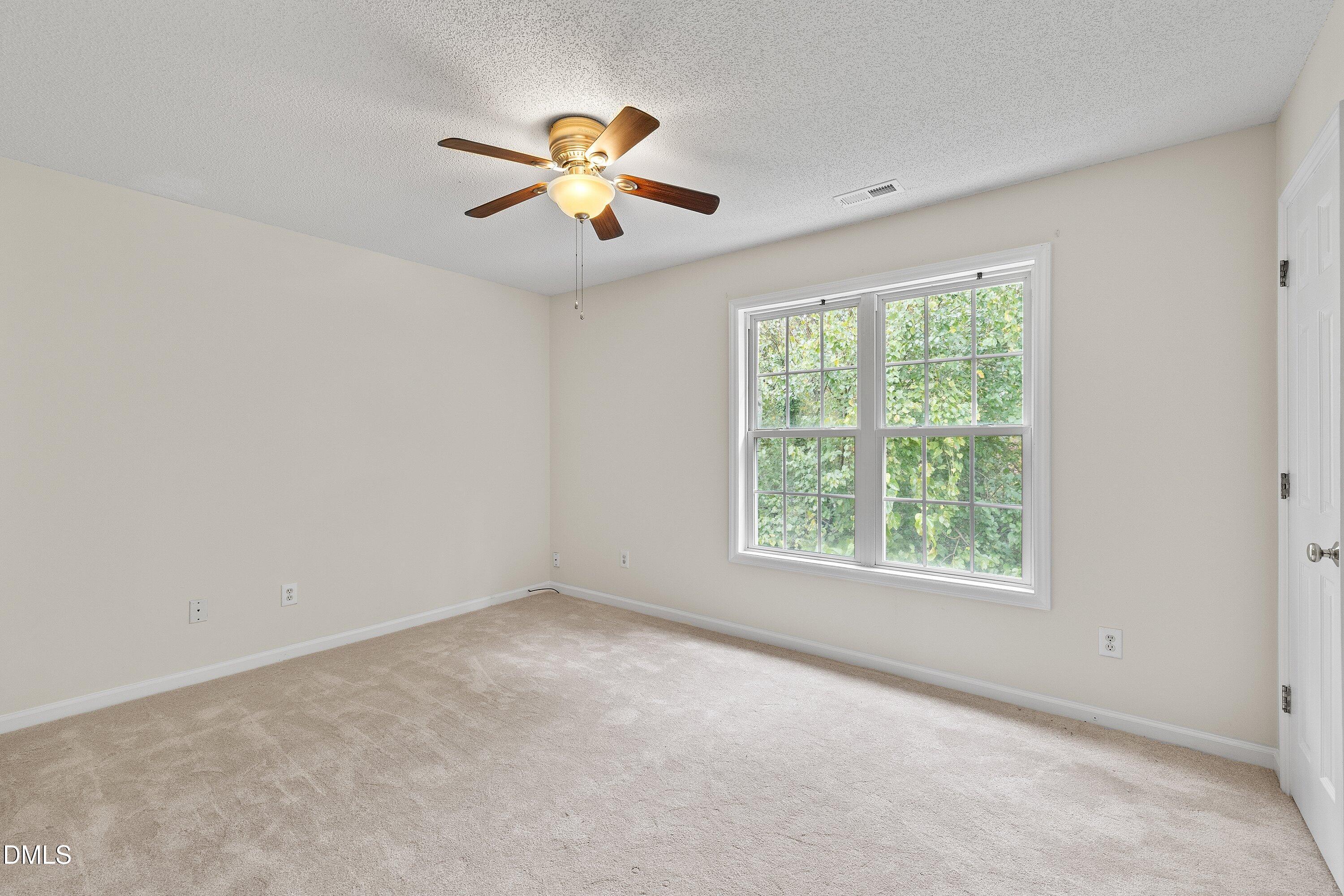 2241 Violet Bluff Court Raleigh, NC 27610 - Photo 20 of 28 an empty room with windows and fan