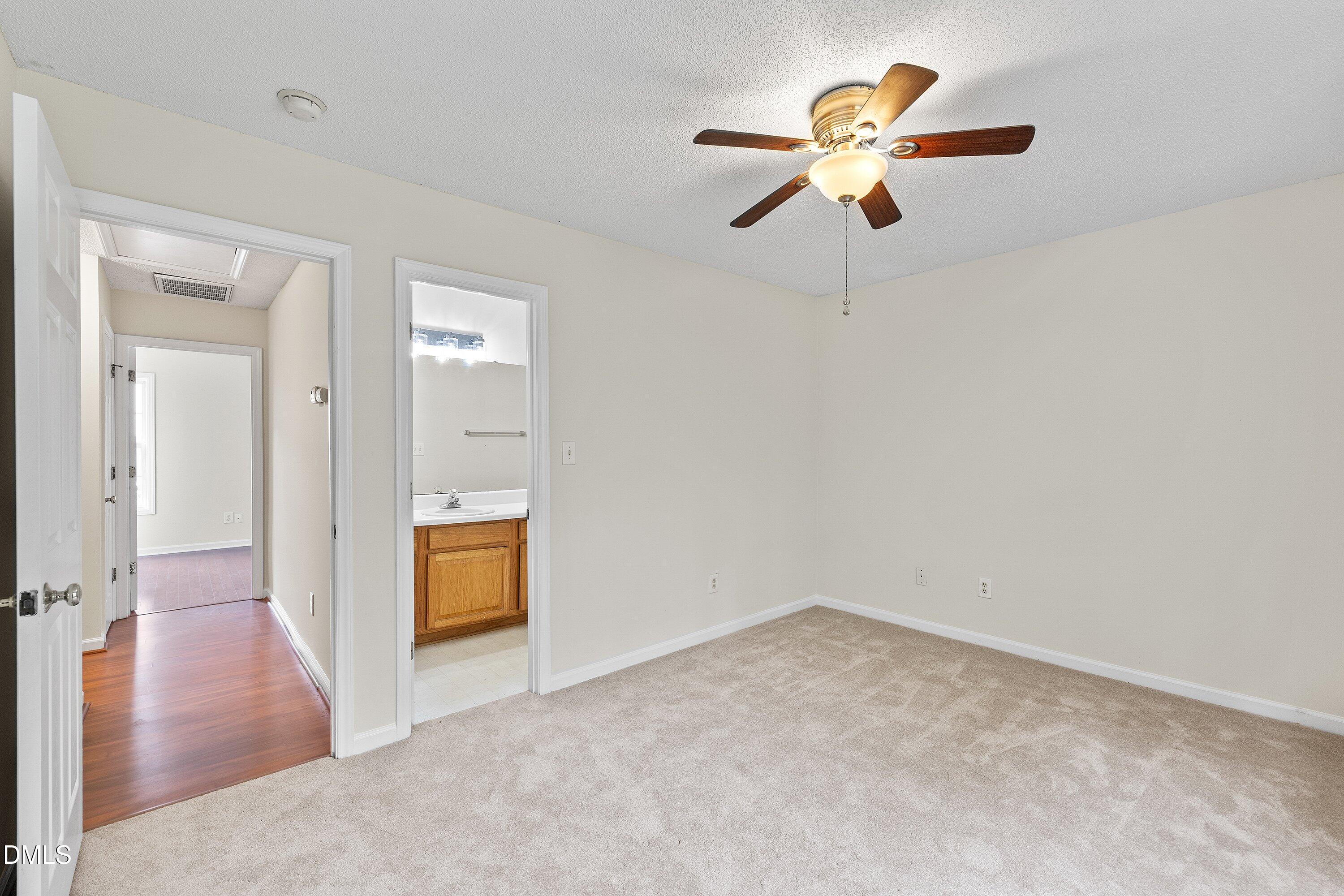 2241 Violet Bluff Court Raleigh, NC 27610 - Photo 21 of 28 wooden floor in an empty room with a window