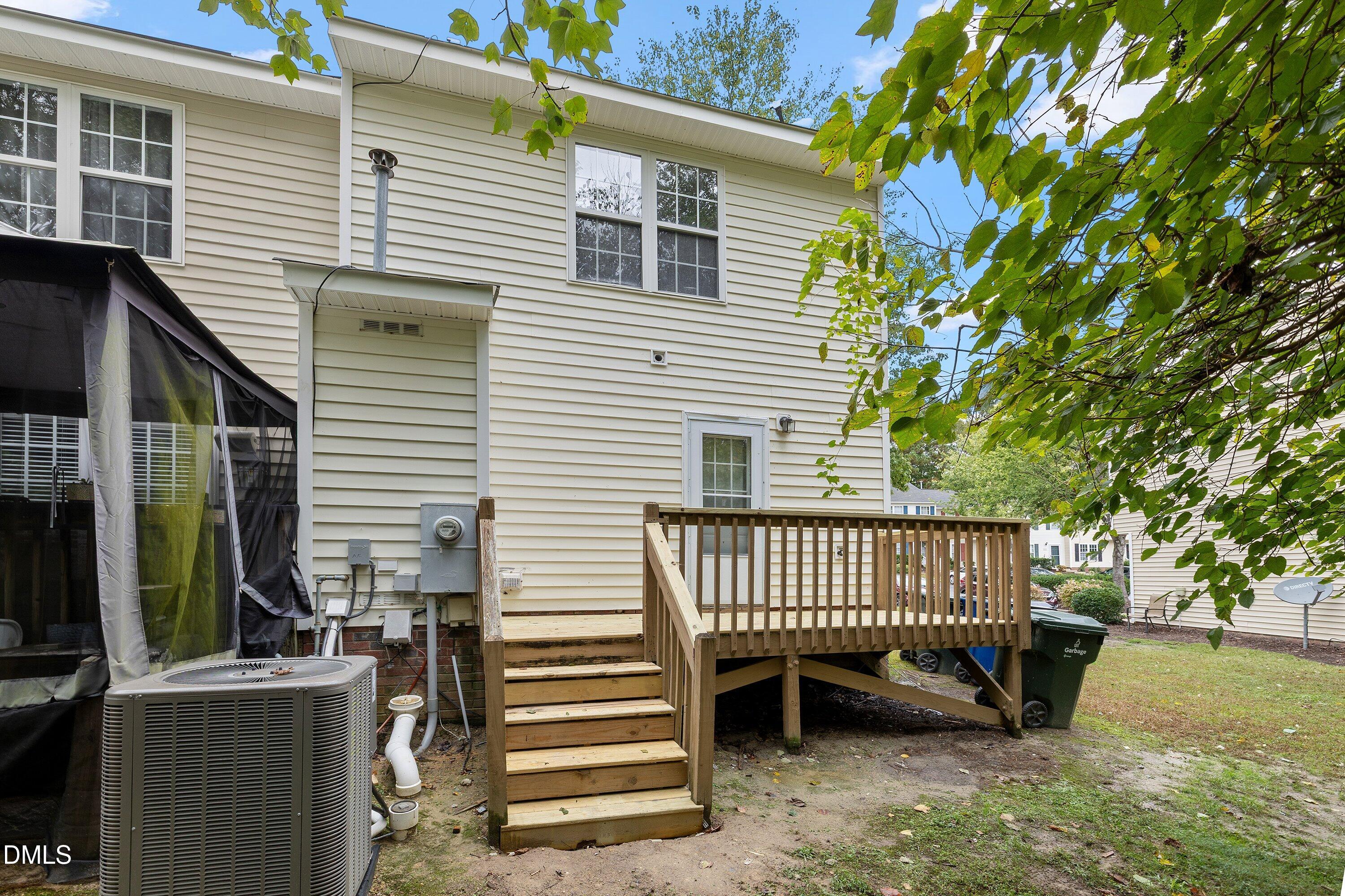 2241 Violet Bluff Court Raleigh, NC 27610 - Photo 25 of 28 a view of a chair and table in the back yard
