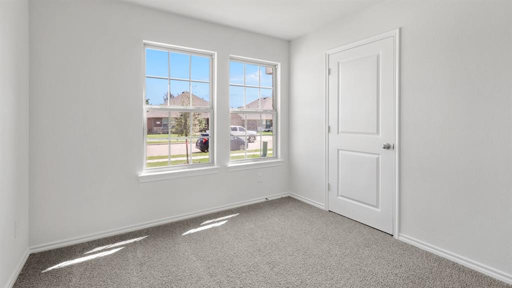 1913 Reveille Way Terrell, TX 75160 - Photo 20 of 35 Spare room with carpet flooring and baseboards