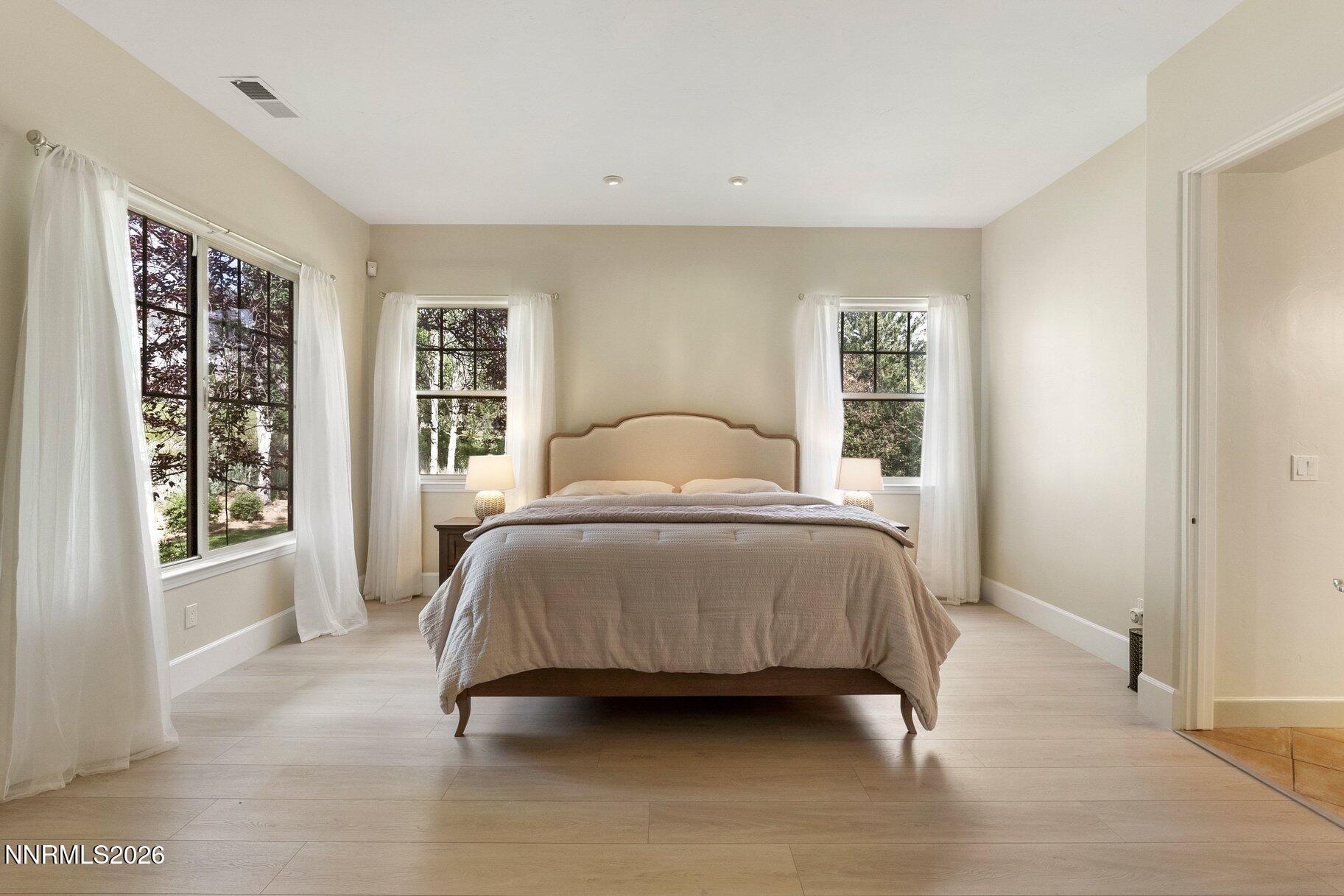 16925 Rue Du Parc Reno, NV 89511 - Photo 15 of 34 a bedroom with a bed lamp and a window