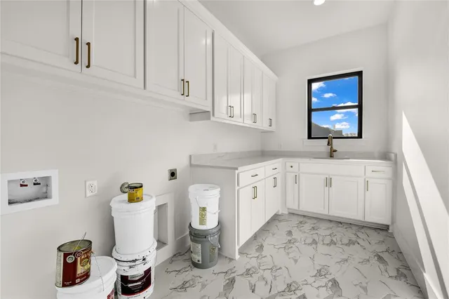 a kitchen with a sink and a stove