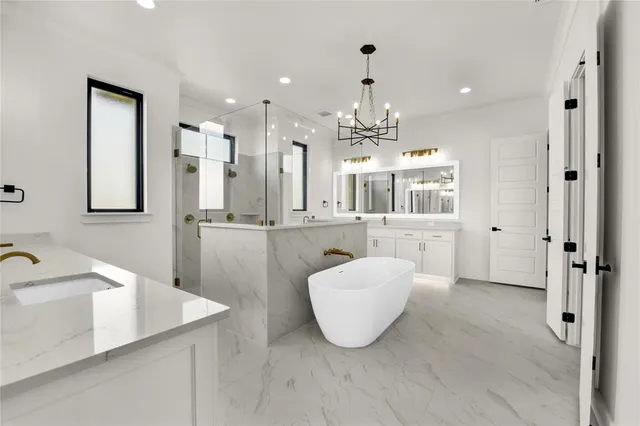 a large bathroom with a double vanity sink a mirror and a bathtub