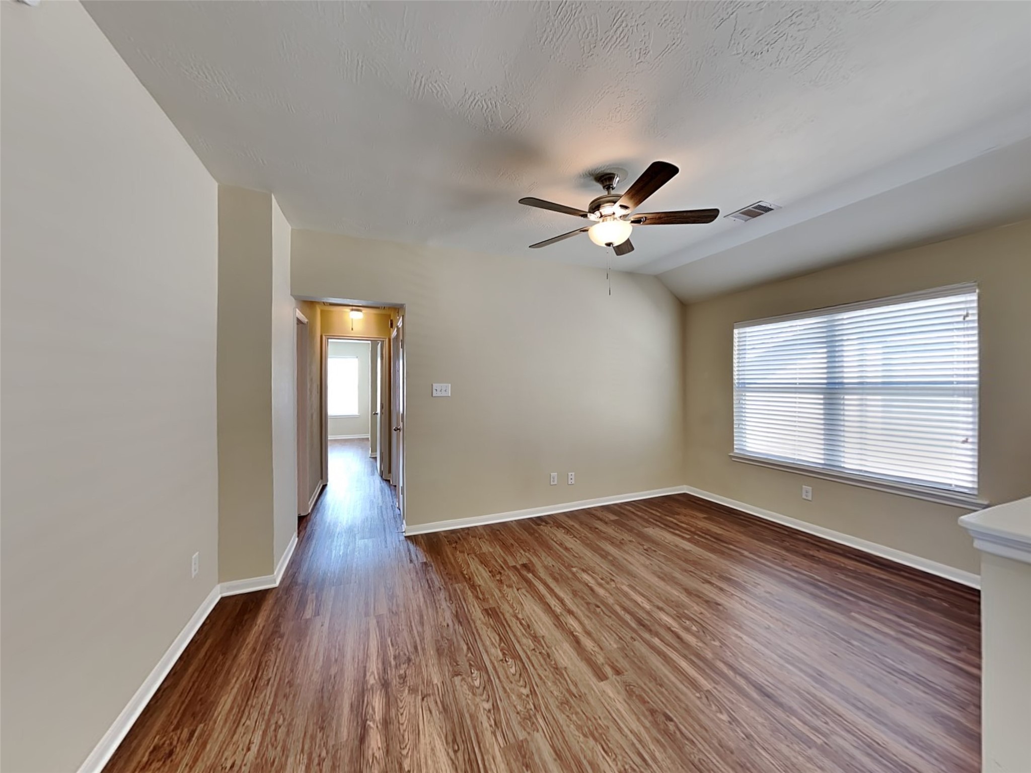 19022 Walbrook Meadows Lane Cypress, TX 77433 - Photo 11 of 23 wooden floor in an empty room with a window