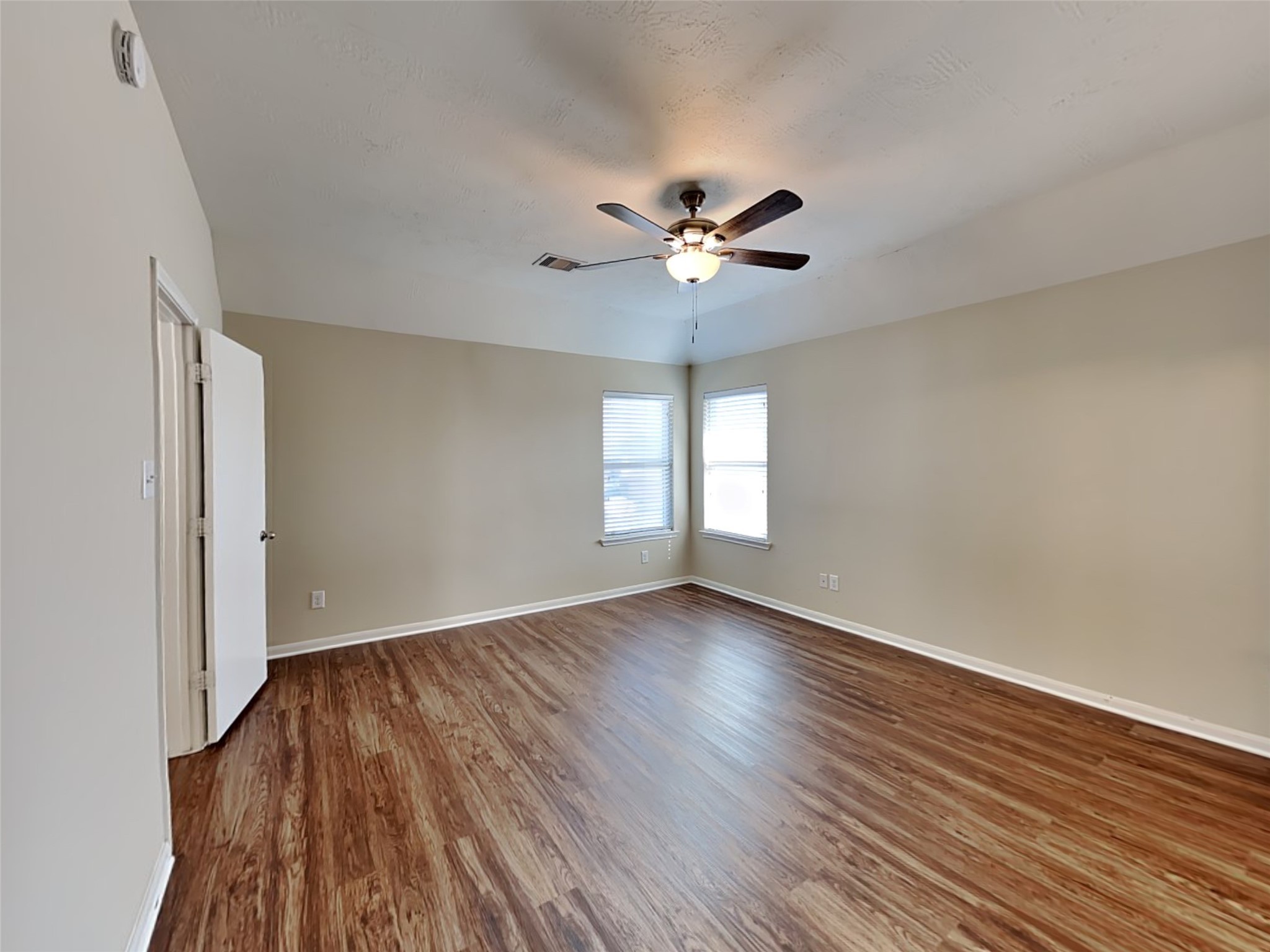 19022 Walbrook Meadows Lane Cypress, TX 77433 - Photo 14 of 23 a view of empty room with wooden floor and fan