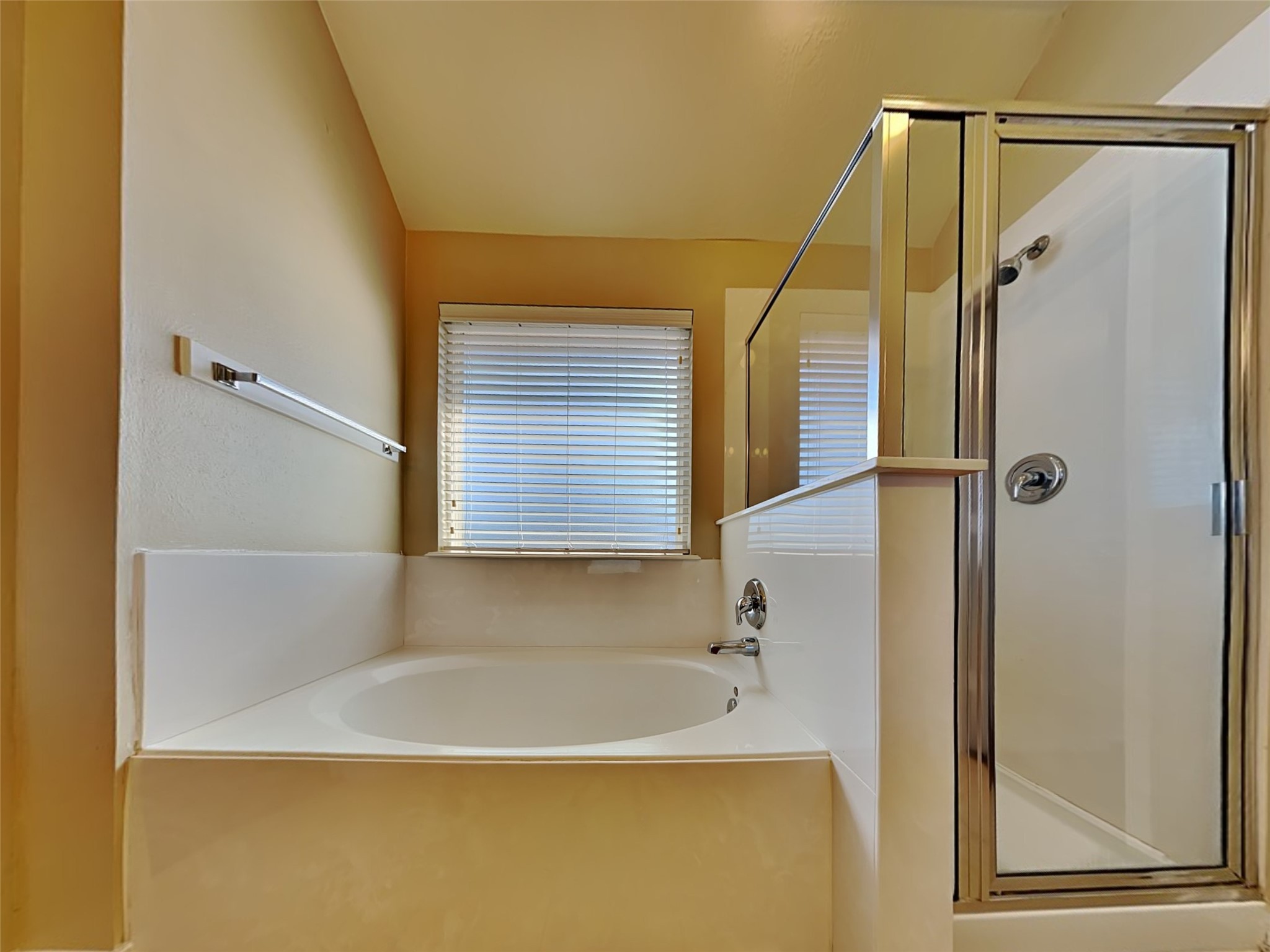 19022 Walbrook Meadows Lane Cypress, TX 77433 - Photo 16 of 23 a bathroom with a bathtub and a shower