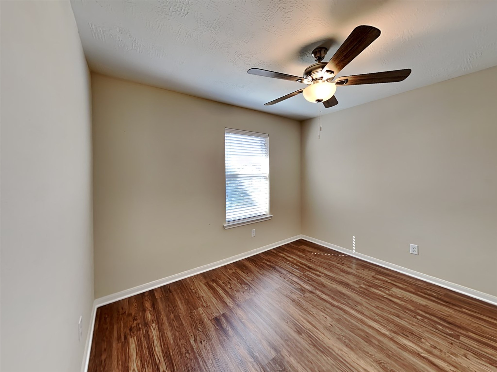 19022 Walbrook Meadows Lane Cypress, TX 77433 - Photo 18 of 23 wooden floor in an empty room with a window