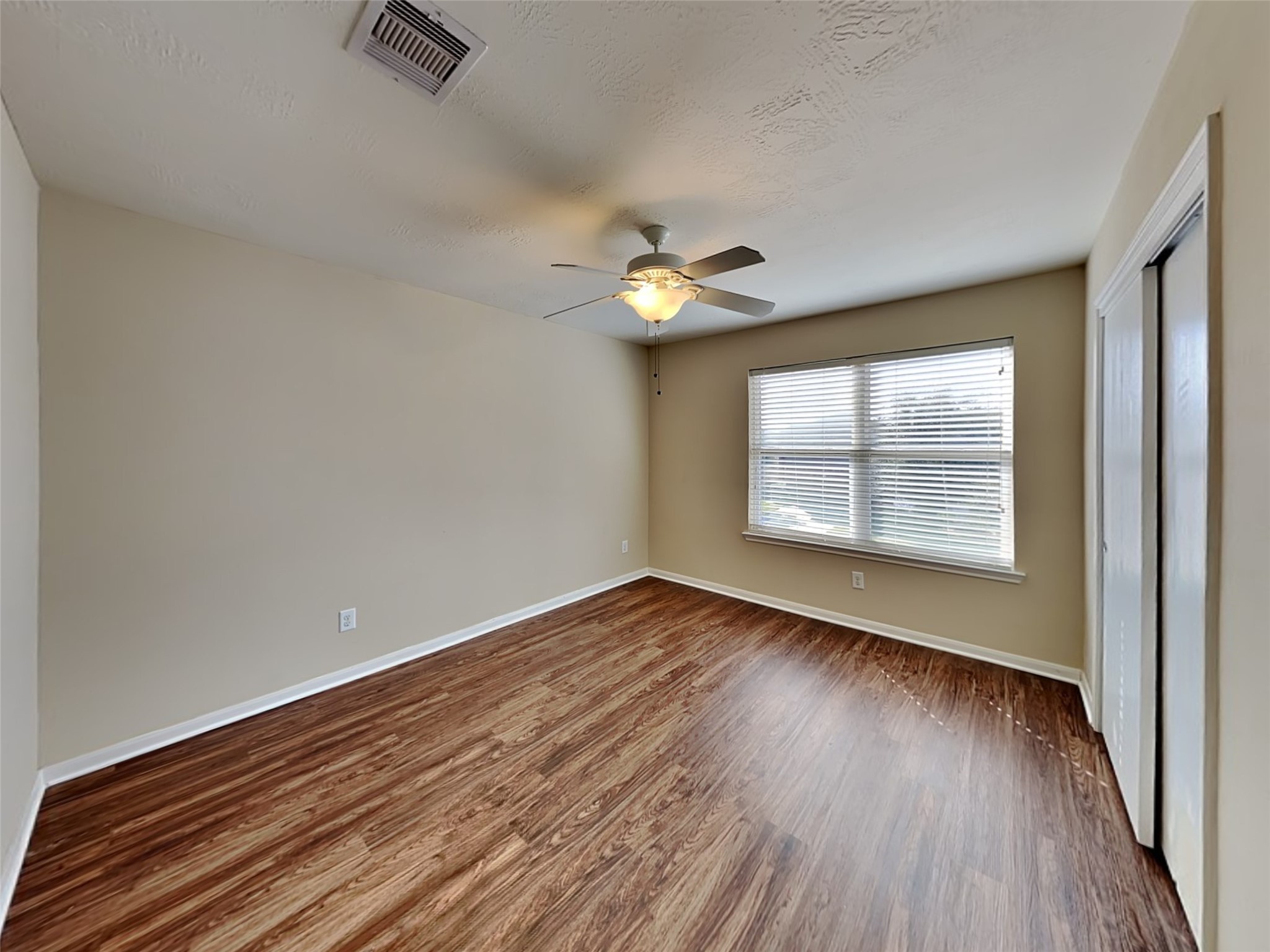 19022 Walbrook Meadows Lane Cypress, TX 77433 - Photo 21 of 23 wooden floor in an empty room with a window
