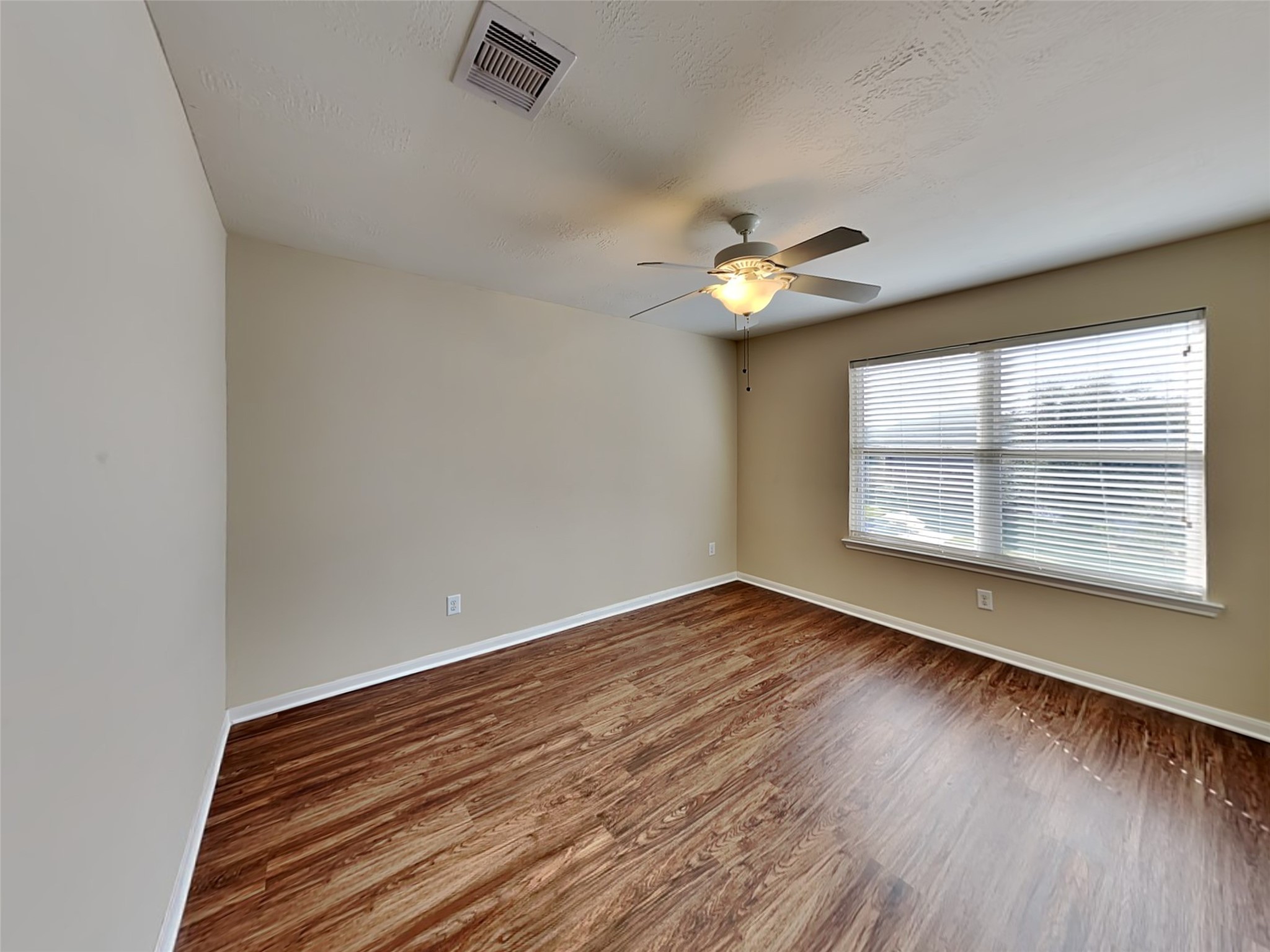 19022 Walbrook Meadows Lane Cypress, TX 77433 - Photo 22 of 23 wooden floor in an empty room with a window